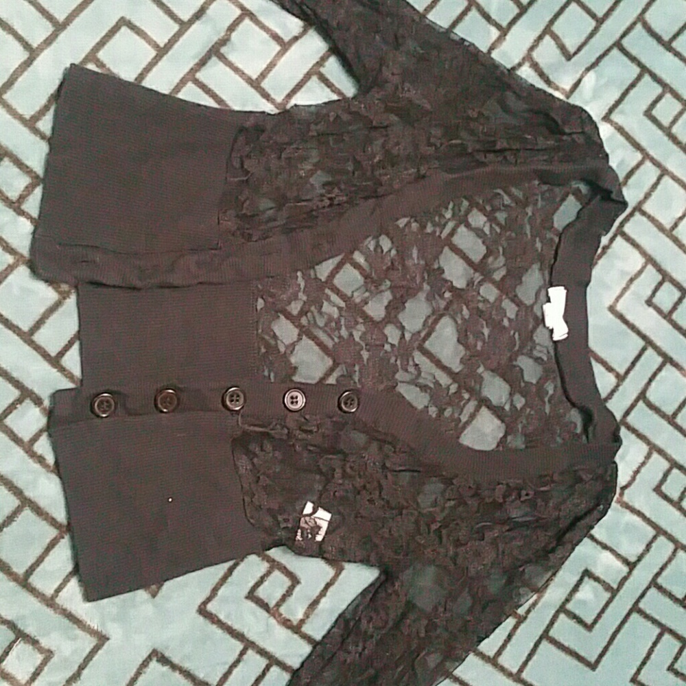 A lacey cover up for a dress or tanktop.
